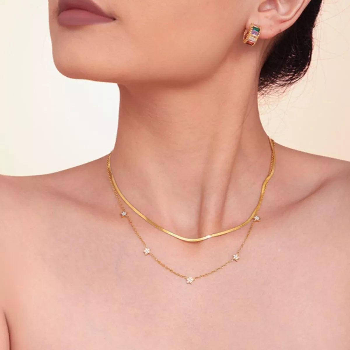 Gold-plated double necklace with curved link chain and dangling star zircon charms