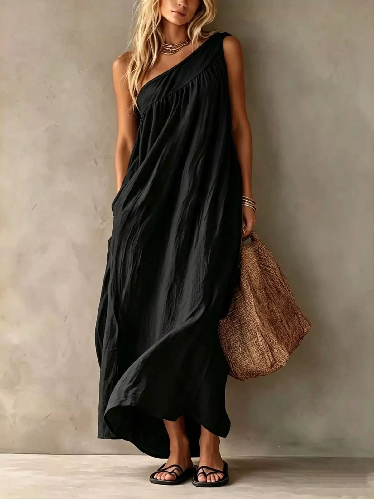 Black one-shoulder stretch maxi dress with draped bodice and gathered neckline