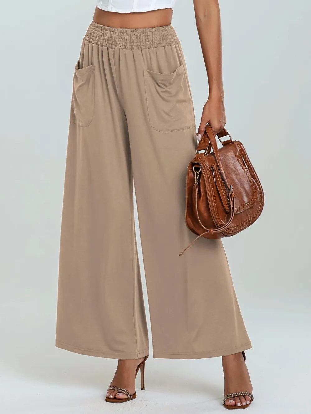 Beige elastic-waist wide-leg pants with side pockets, relaxed drape