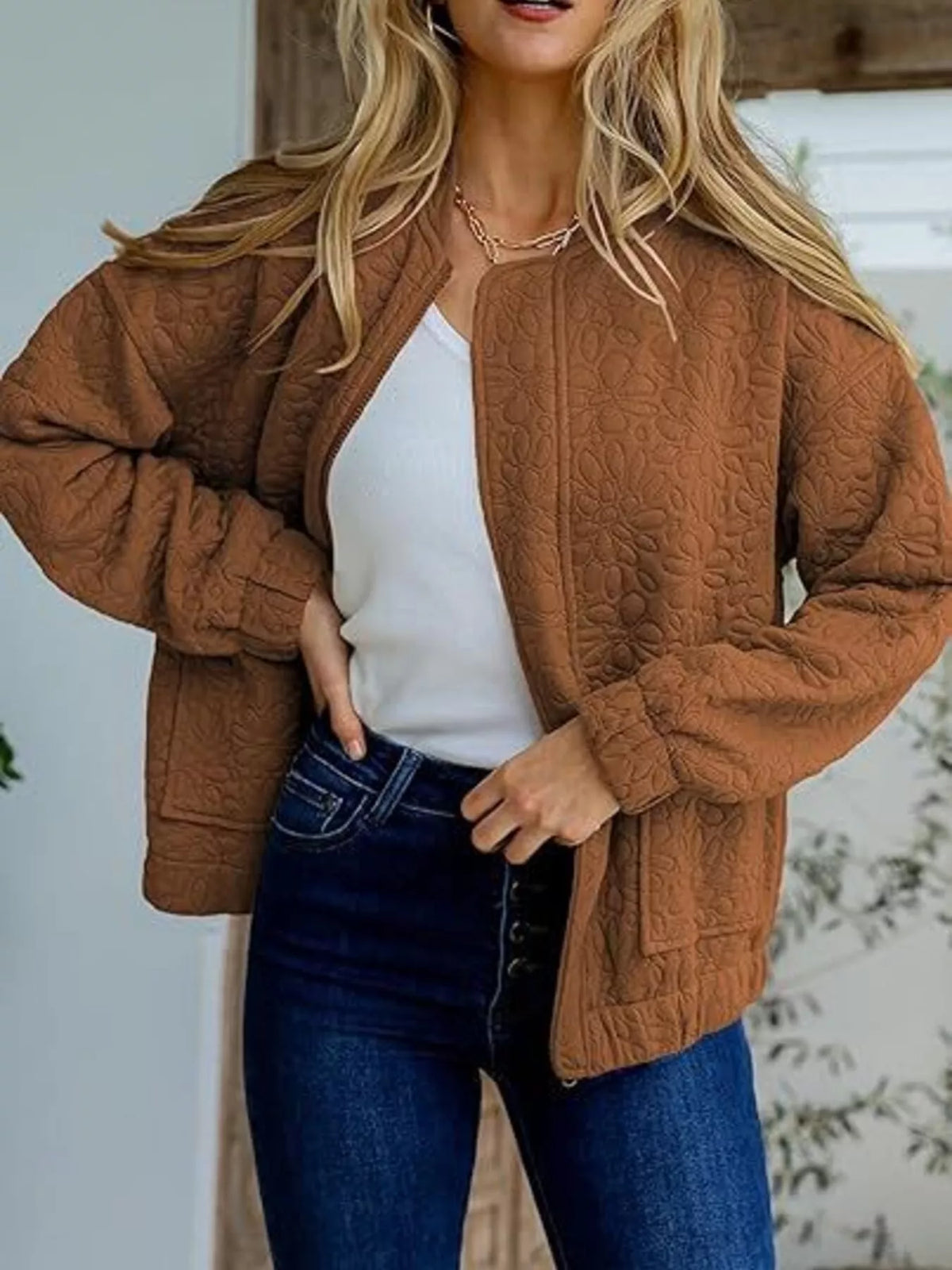 Quilted zip-front jacket in caramel brown with embossed floral texture