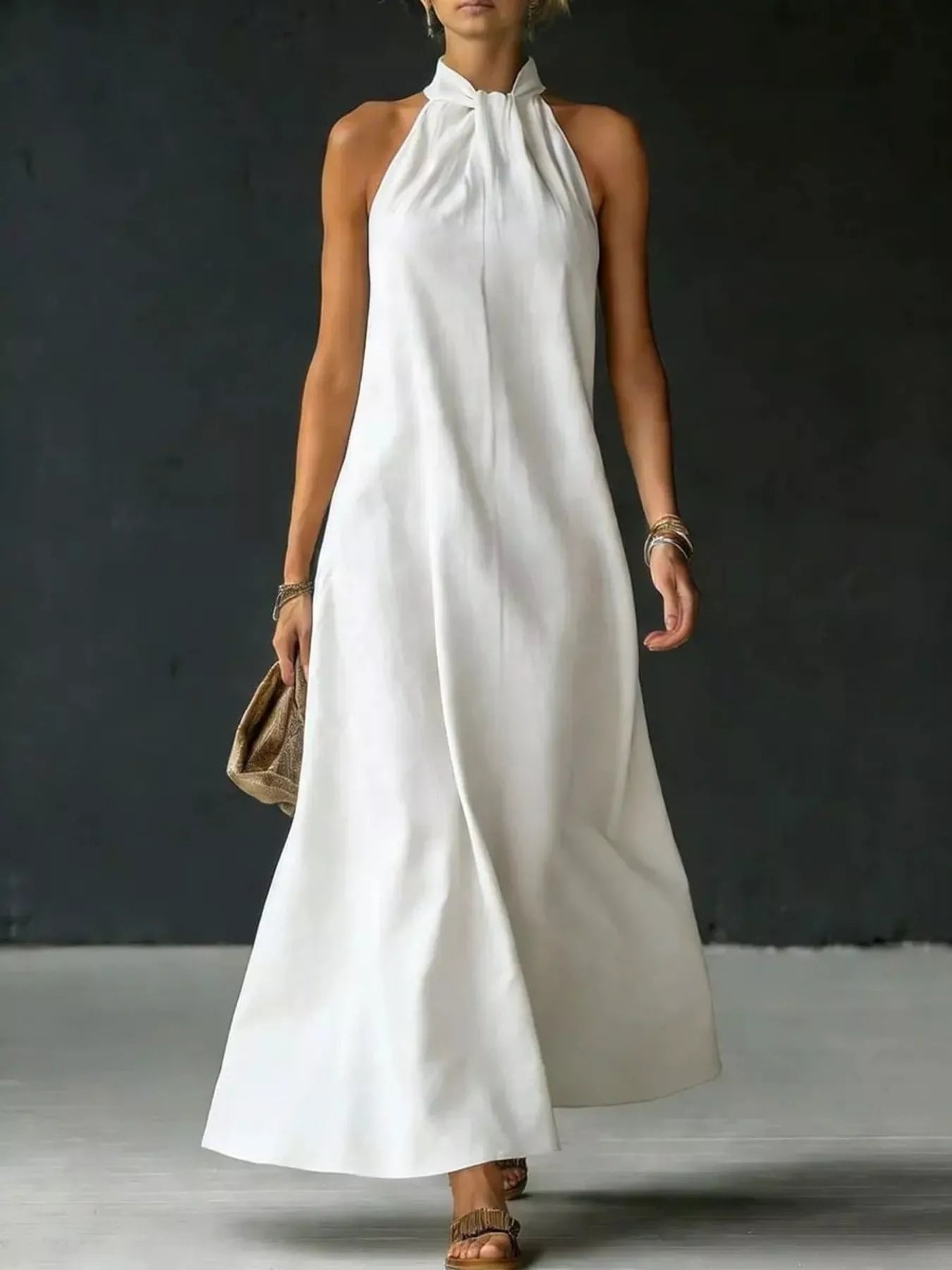 White halter-neck maxi dress with gathered high neckline and sleeveless cut