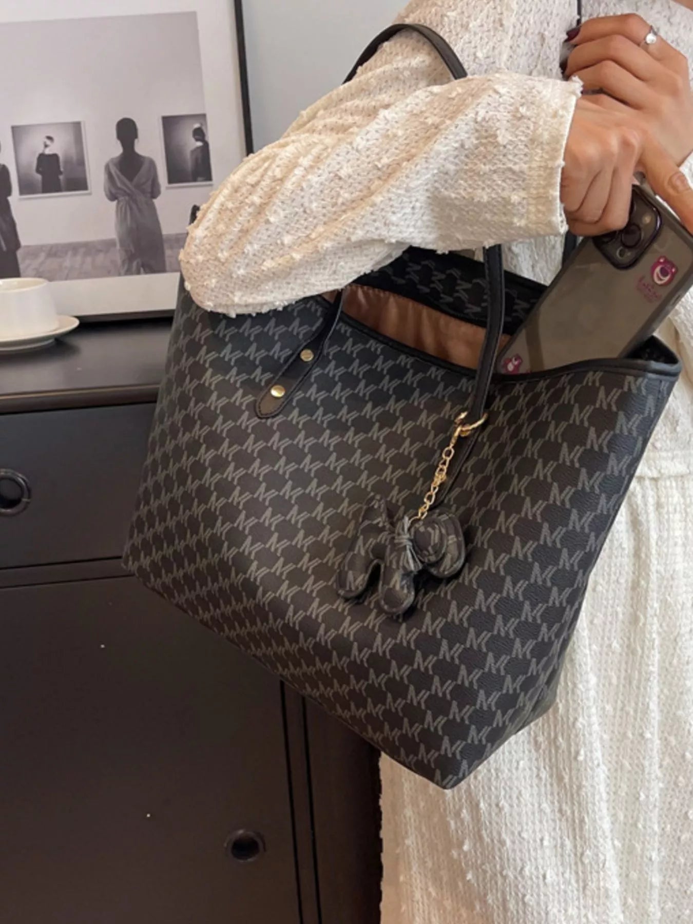 Dark monogram vegan leather shoulder tote with button front and braided chain charm