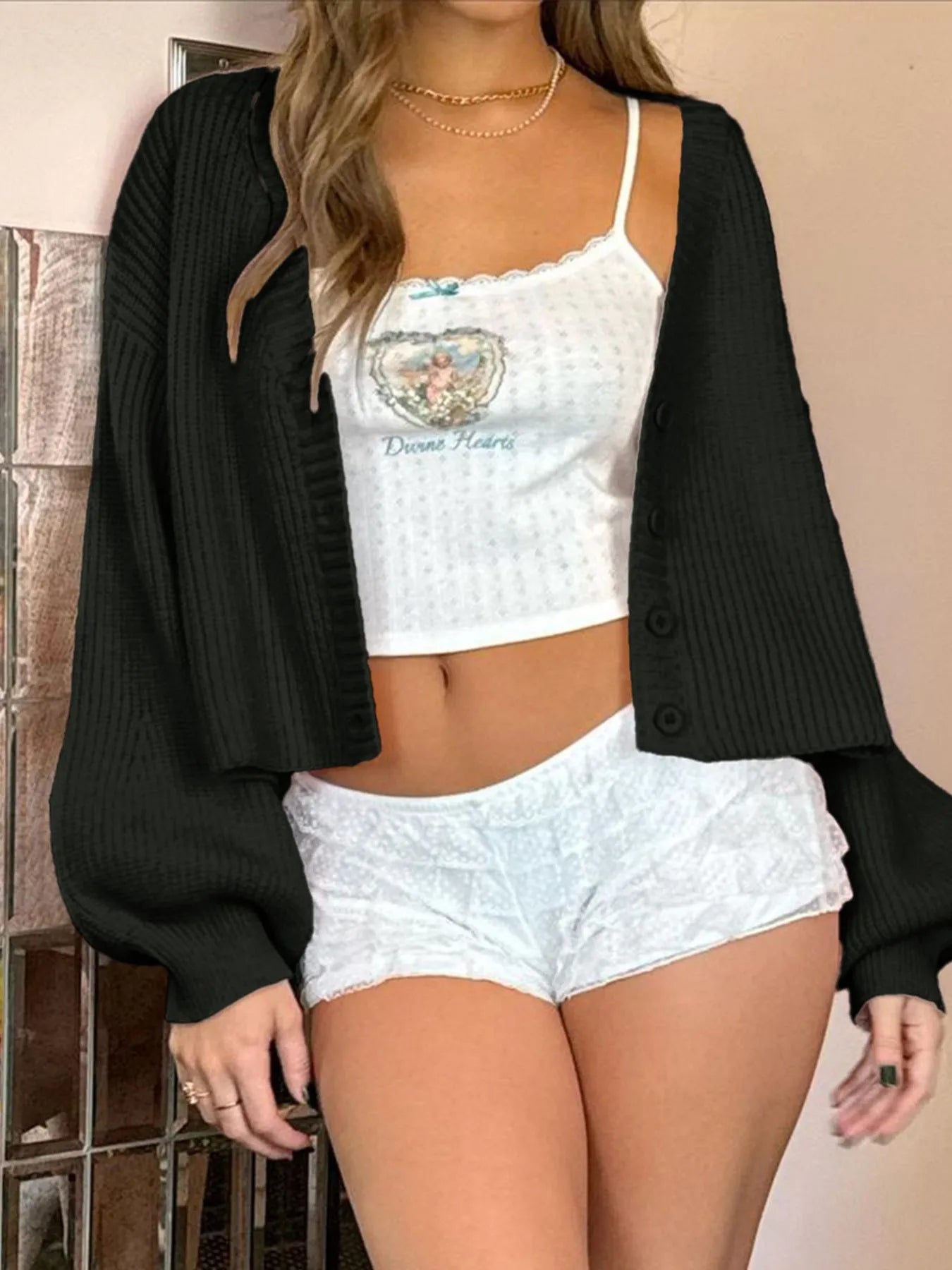 Black ribbed button-up drop-shoulder cardigan with V-neck and long sleeves