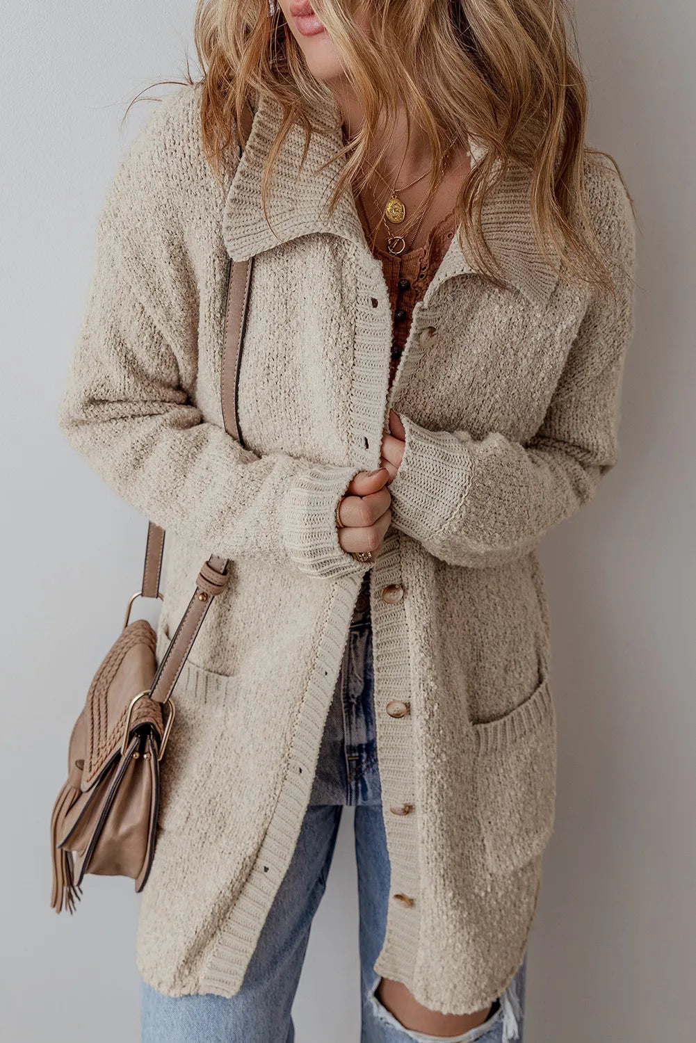 Dust Storm knit button-up cardigan with patch pockets and ribbed cuffs, worn open