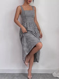 Black-and-white gingham square-neck sleeveless midi dress with gathered waist and flowy skirt