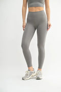 High-waisted pewter gray leggings with contoured seams and ankle length