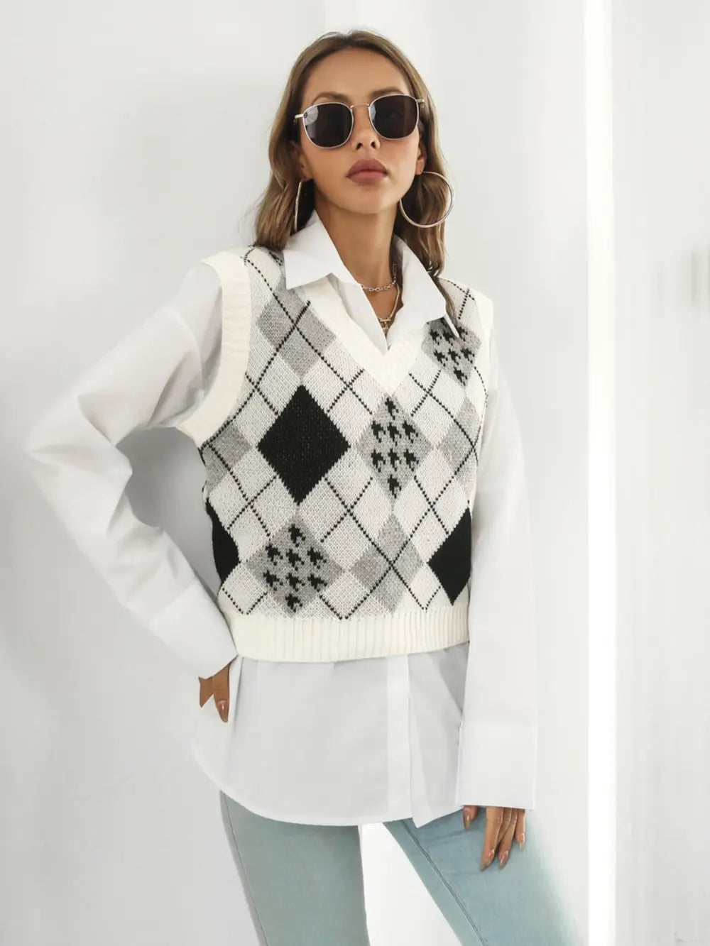 Front view V-neck plaid sweater vest, white knit with black diamond argyle pattern