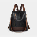 Vegan leather backpack bag in dark brown and black, textured front, zip pocket