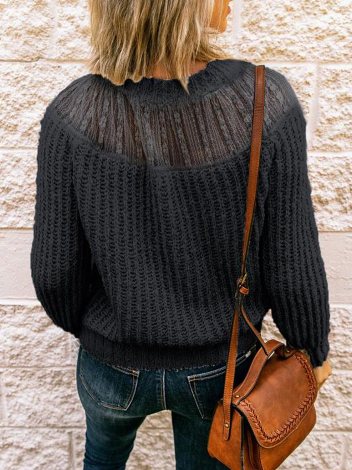 Black round-neck rib-knit sweater with long sleeves and ribbed neckline, back view