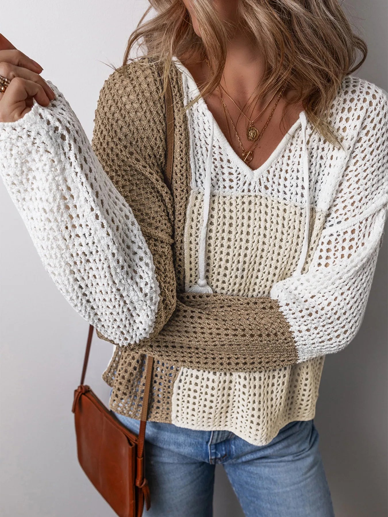 Openwork knit sweater with V-neck, tassel ties, beige and white color block sleeves