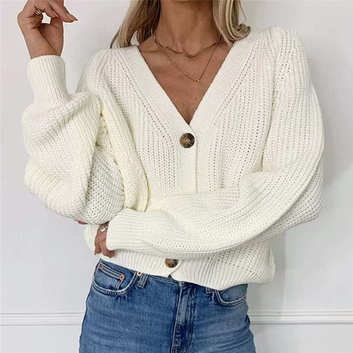 White/off-white V-neck button-front long sleeve cardigan with ribbed cuffs