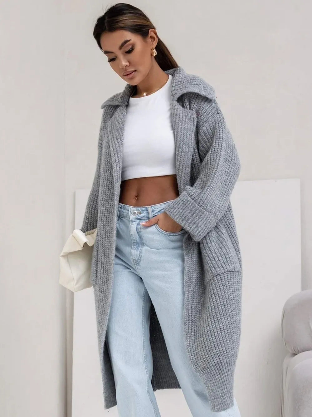 Gray cardigan with collared neck, dropped shoulders, and ribbed knit texture