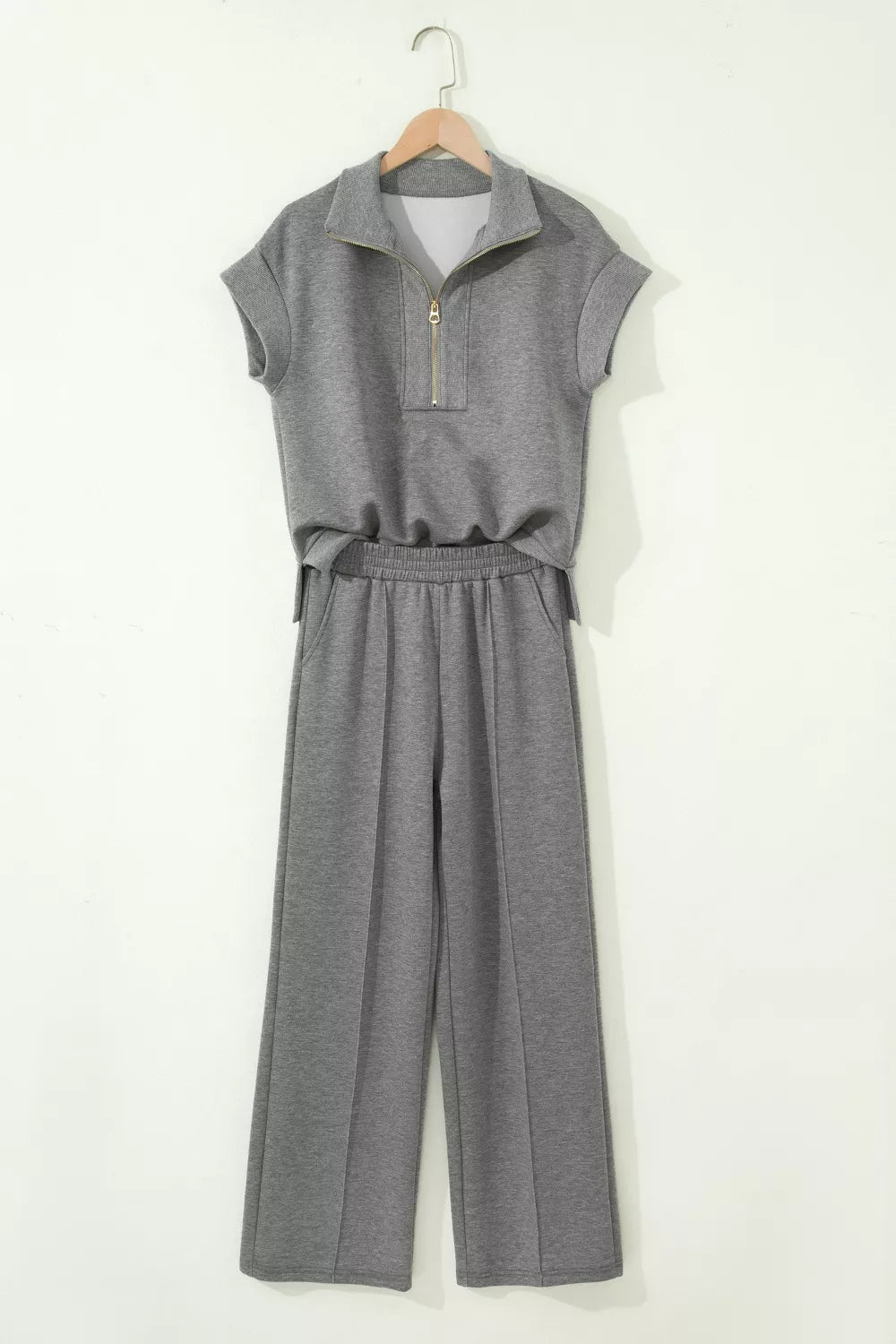Dark gray two-piece set with half-zip polo top and wide-leg lounge pants.