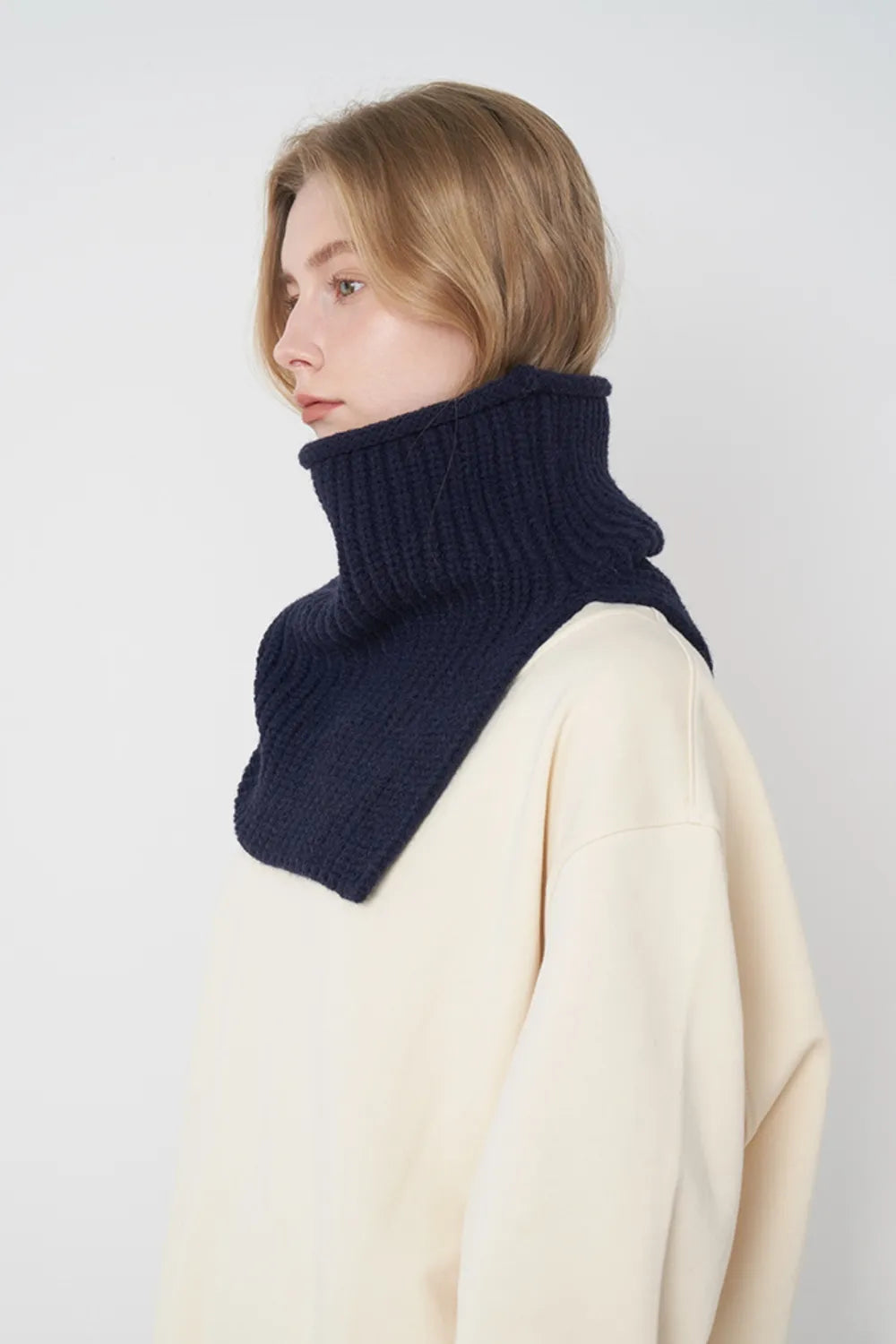 Dark navy ribbed knit scarf with folded cowl wrap around the neck