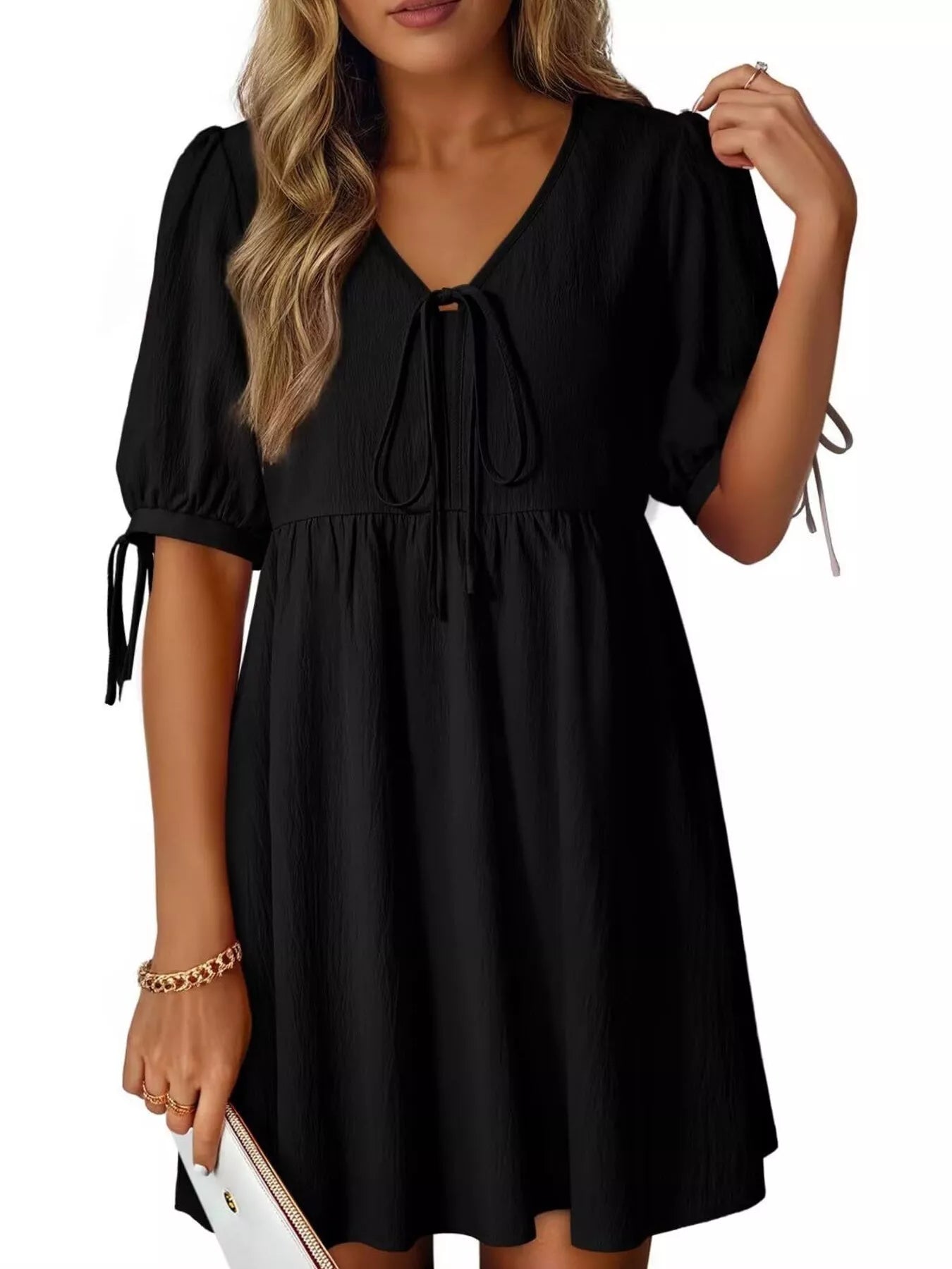 Tie-Neck Puff Sleeve A-Line Mini Dress in black with bow neckline and short puff sleeves.