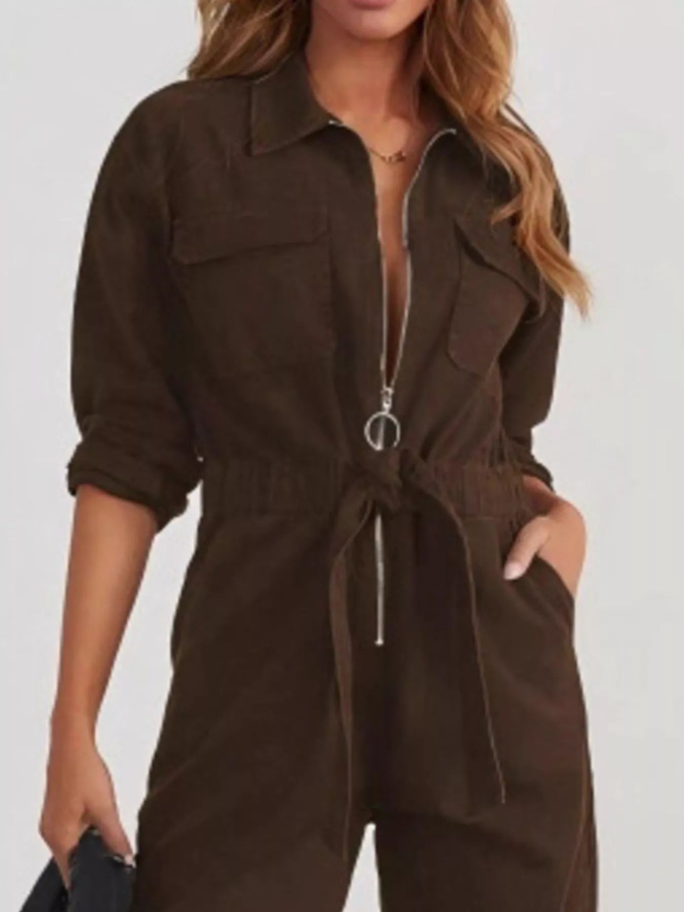 Dark brown long-sleeve zip-front jumpsuit with front pockets and drawstring waist