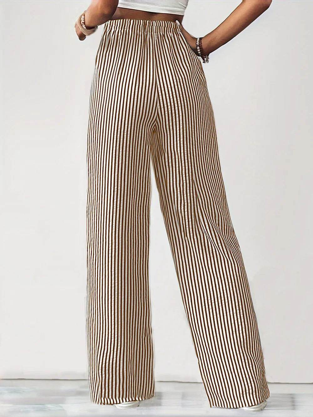 Striped elastic waist drawstring pants in tan and white, wide-leg silhouette