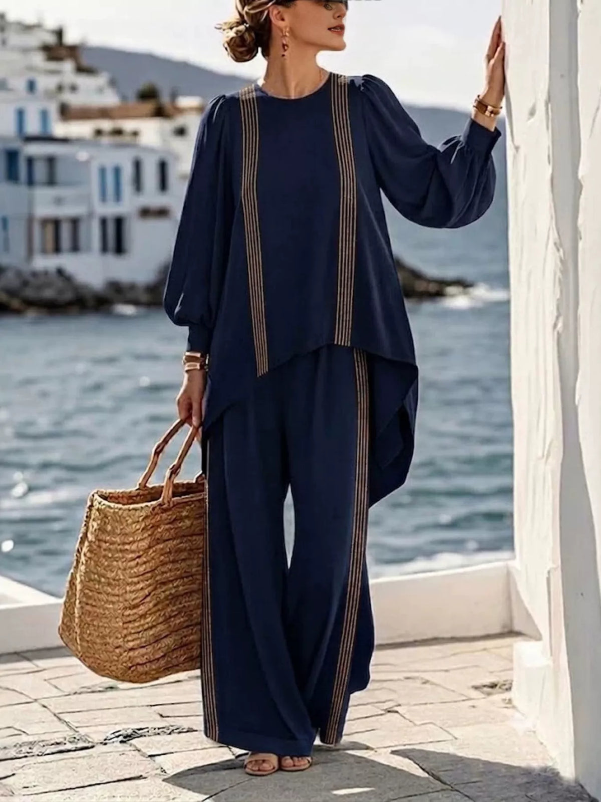 Two-piece striped top and pants set in navy, flowy blouse with long sleeves