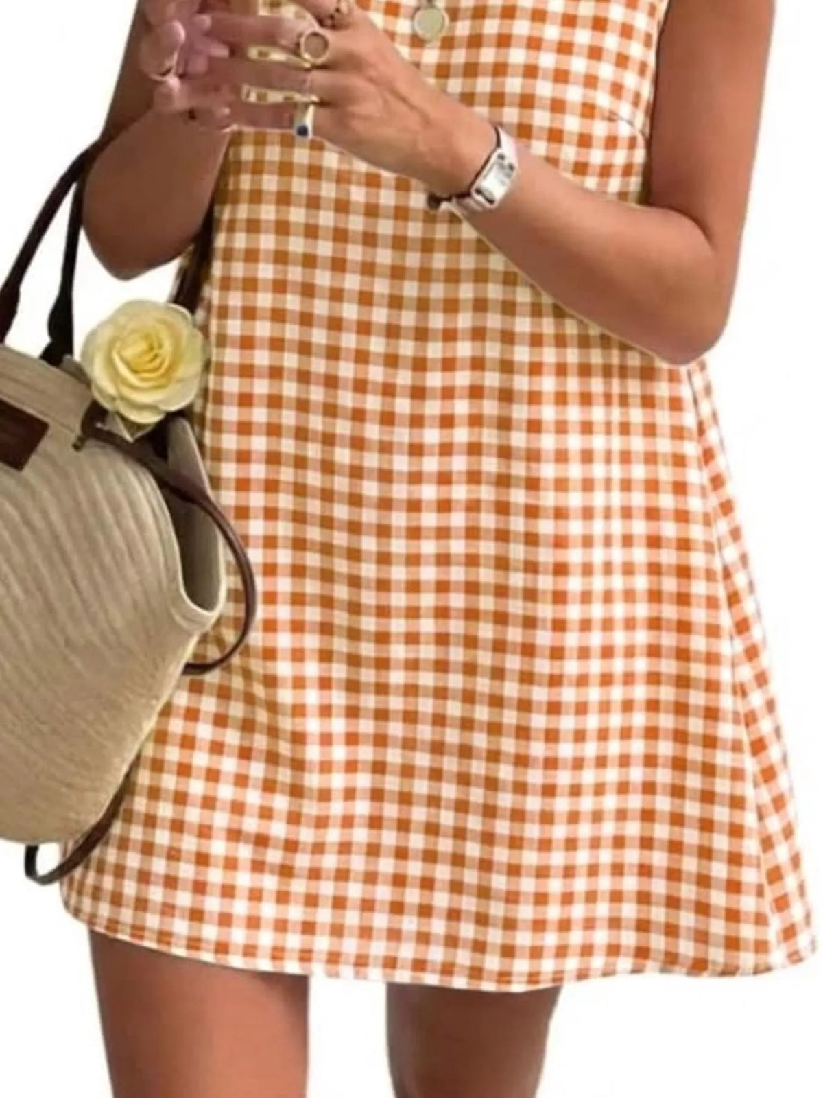 Orange and white gingham sleeveless A-line mini dress with flared hem