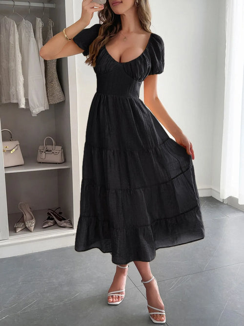 Black backless tiered midi dress with puff sleeves and V-neck, gathered bodice