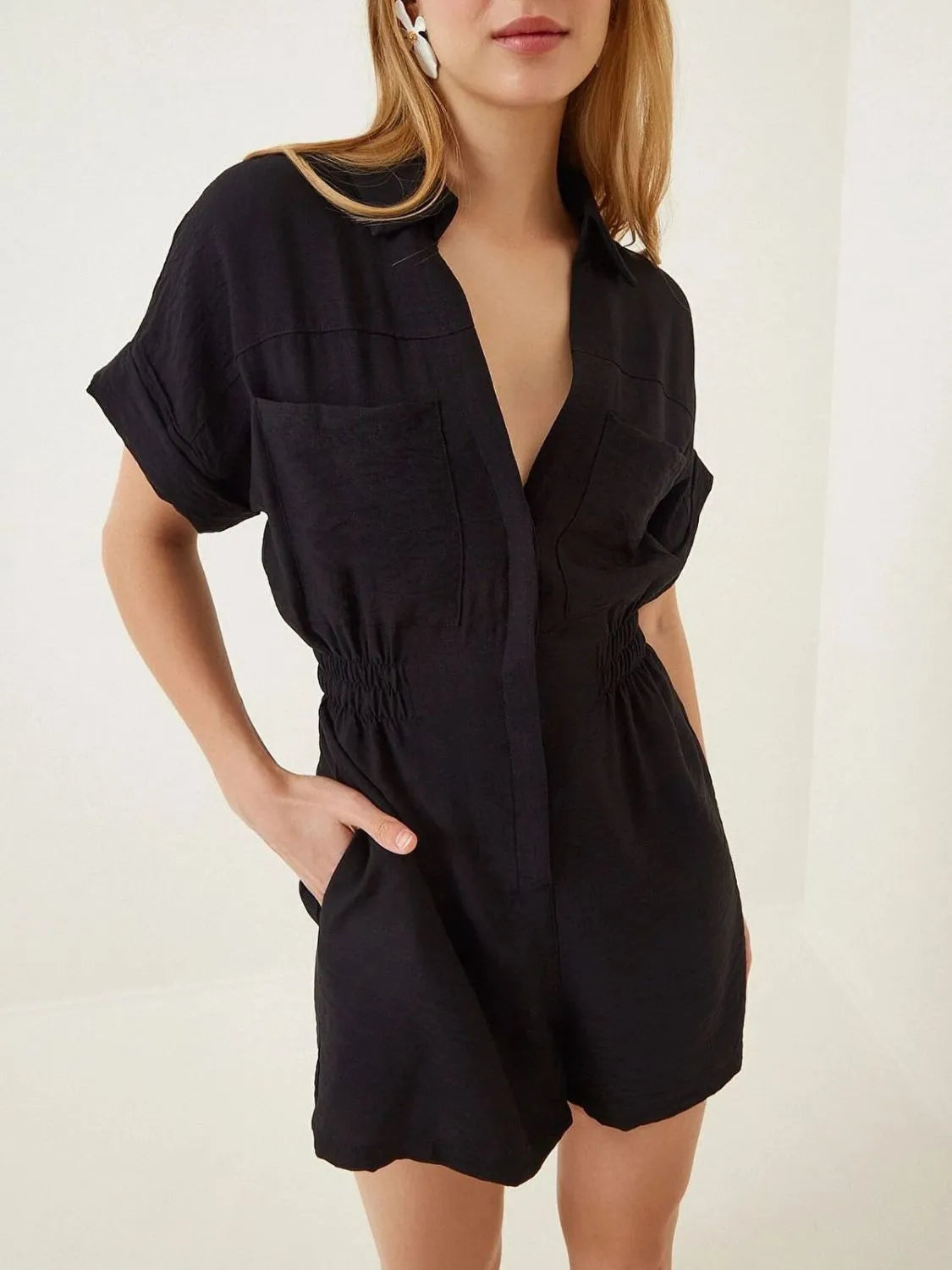 Black collar short-sleeve romper with button placket, chest pockets, elastic waist