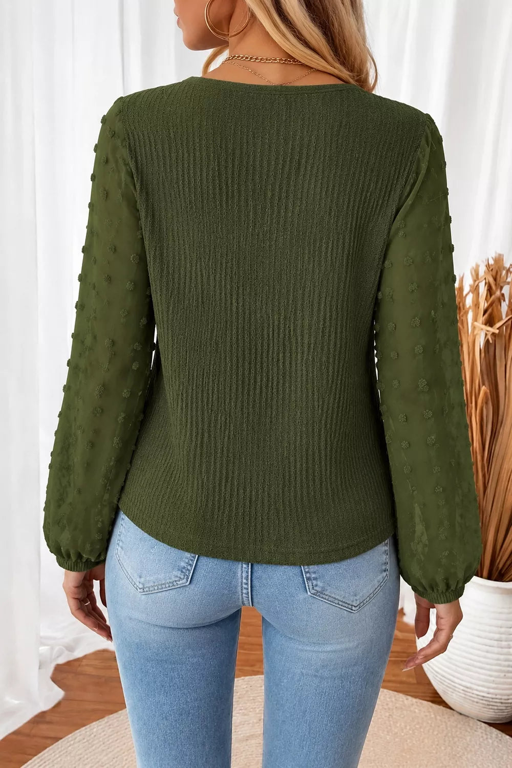 Dark green long-sleeve blouse with gathered swiss-dot sleeves, V-neck back view