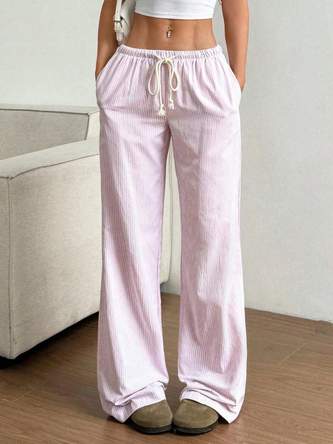 Light pink striped wide-leg pants with elastic drawstring waist and relaxed legs