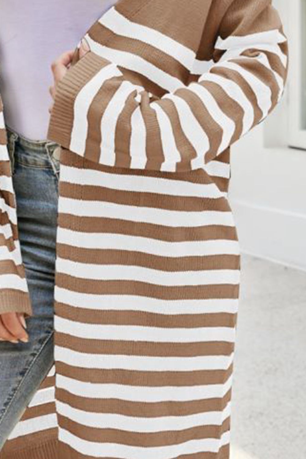 Camel-and-cream striped knit cardigan close-up with bold horizontal stripes