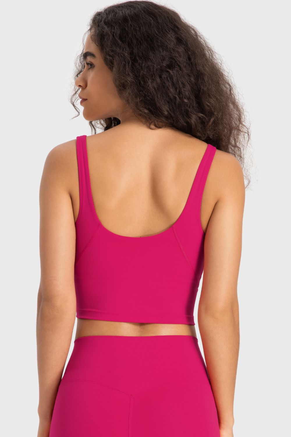 Hot pink crop sports bra with wide racerback and scoop back neckline