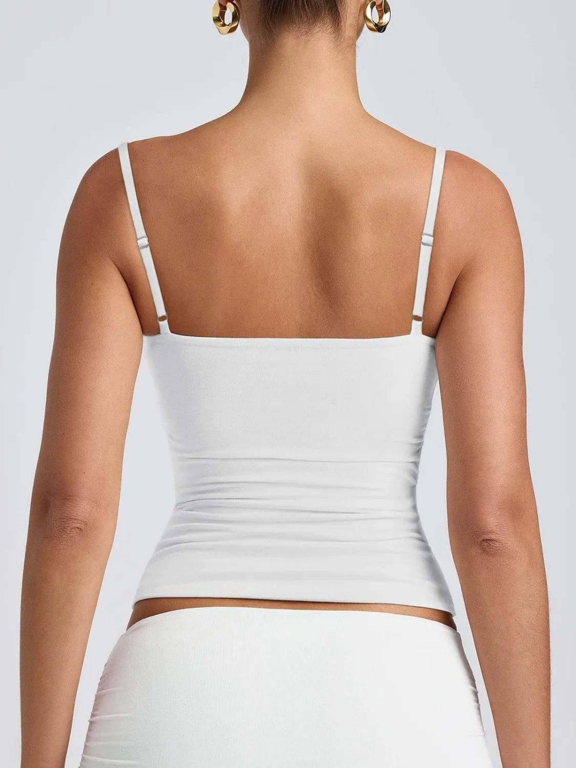 White scoop-neck cami back view with thin straps and ruched side seams