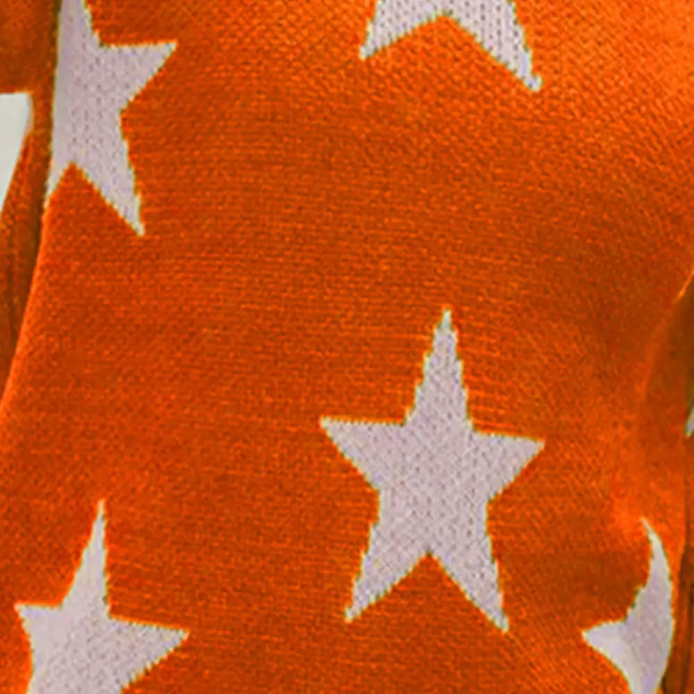Orange knit sweater fabric with scattered white stars on the front