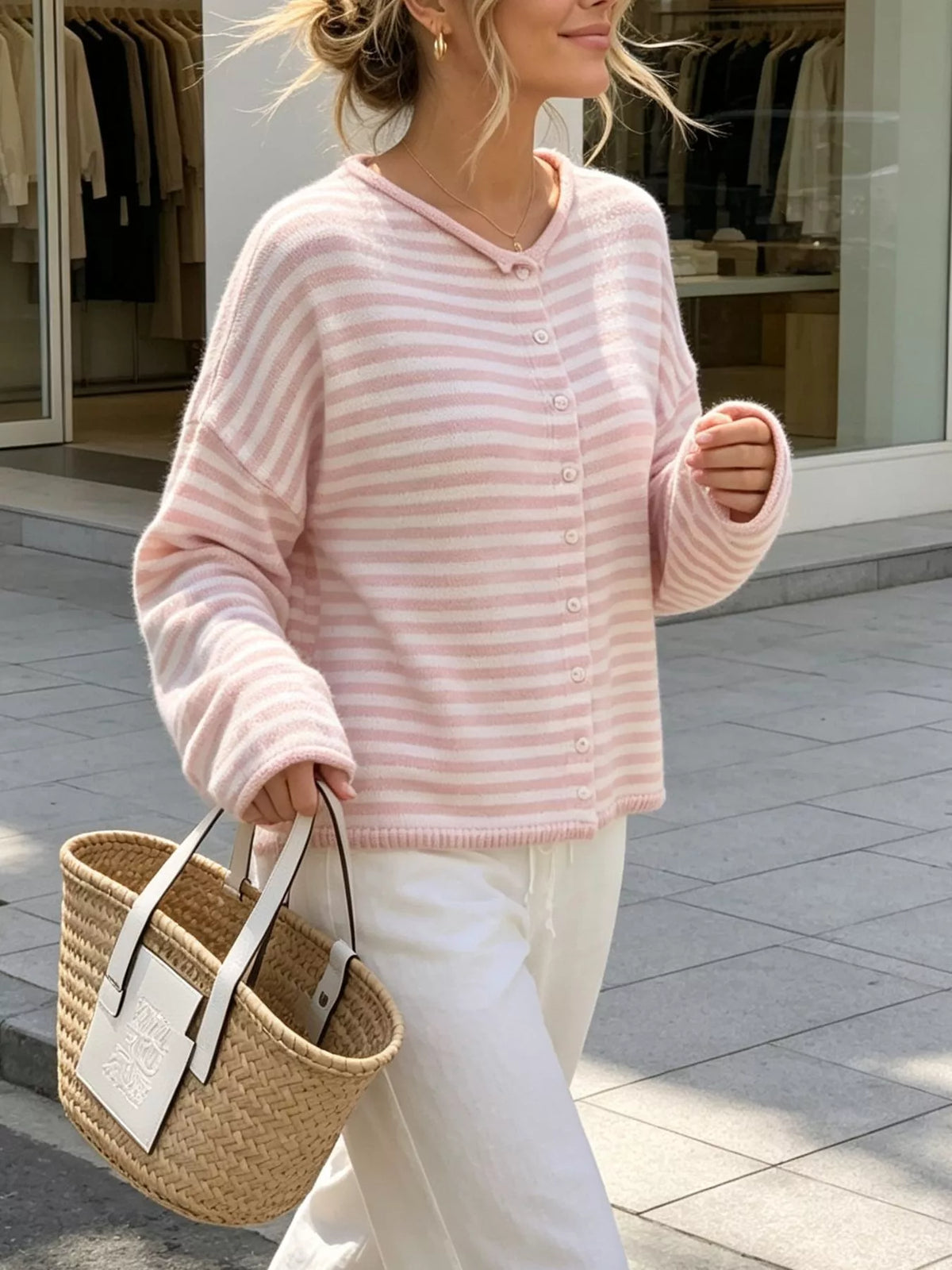 Pink and white striped knit cardigan with button front and long sleeves