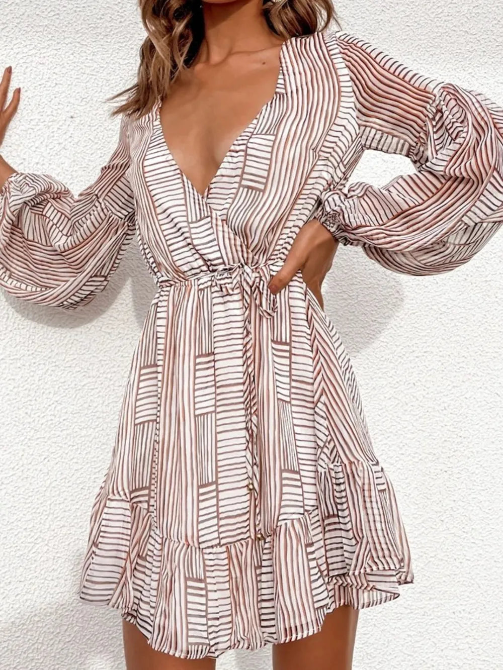 Camel-and-white striped surplice mini dress with V-neck and long puff sleeves