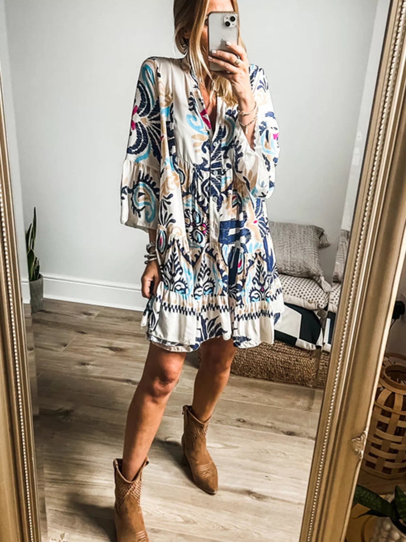 Bohemian print tiered mini dress with flared sleeves, white base and blue abstract print