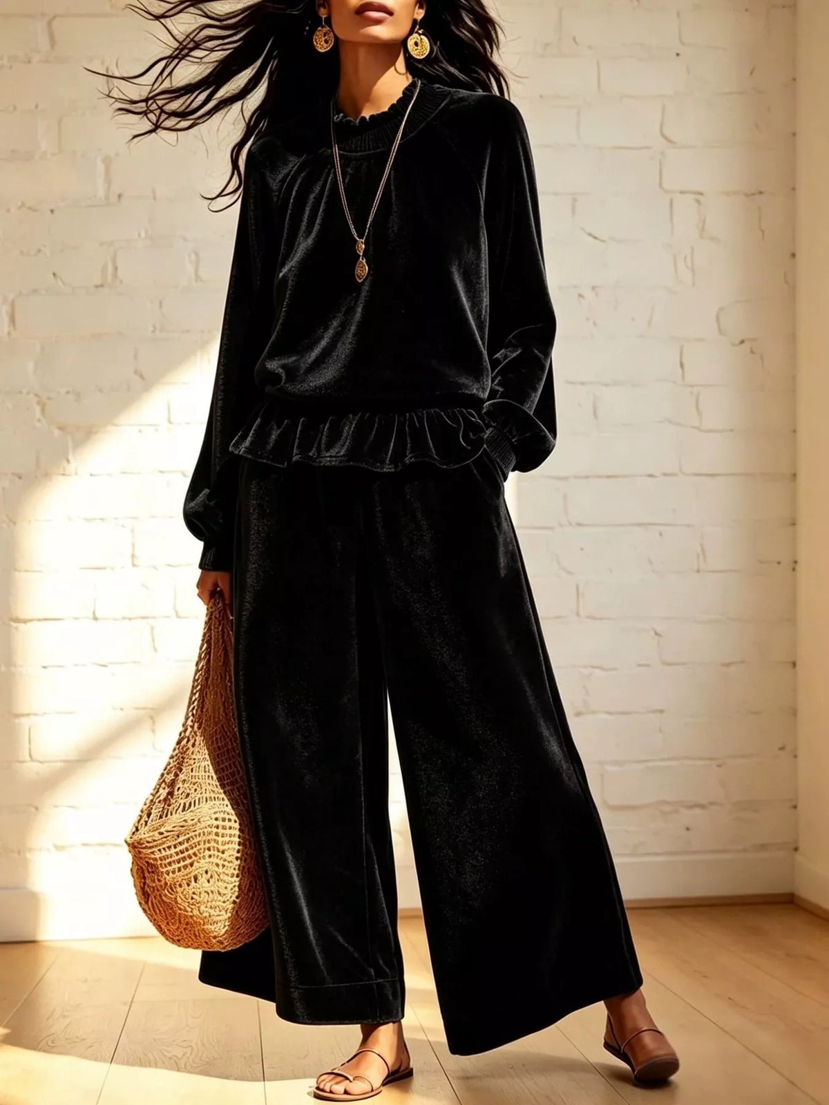 Black velvet ruffled top and wide-leg pants set with long sleeves and scalloped ruffle hem