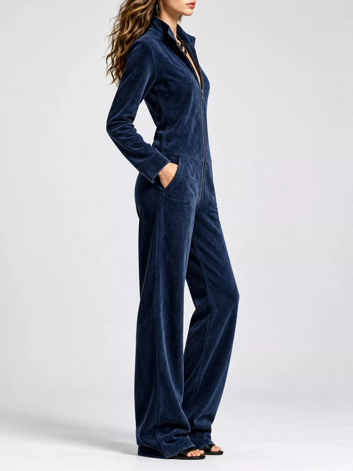 Dark blue velour zip-front jumpsuit with side pockets and long sleeves