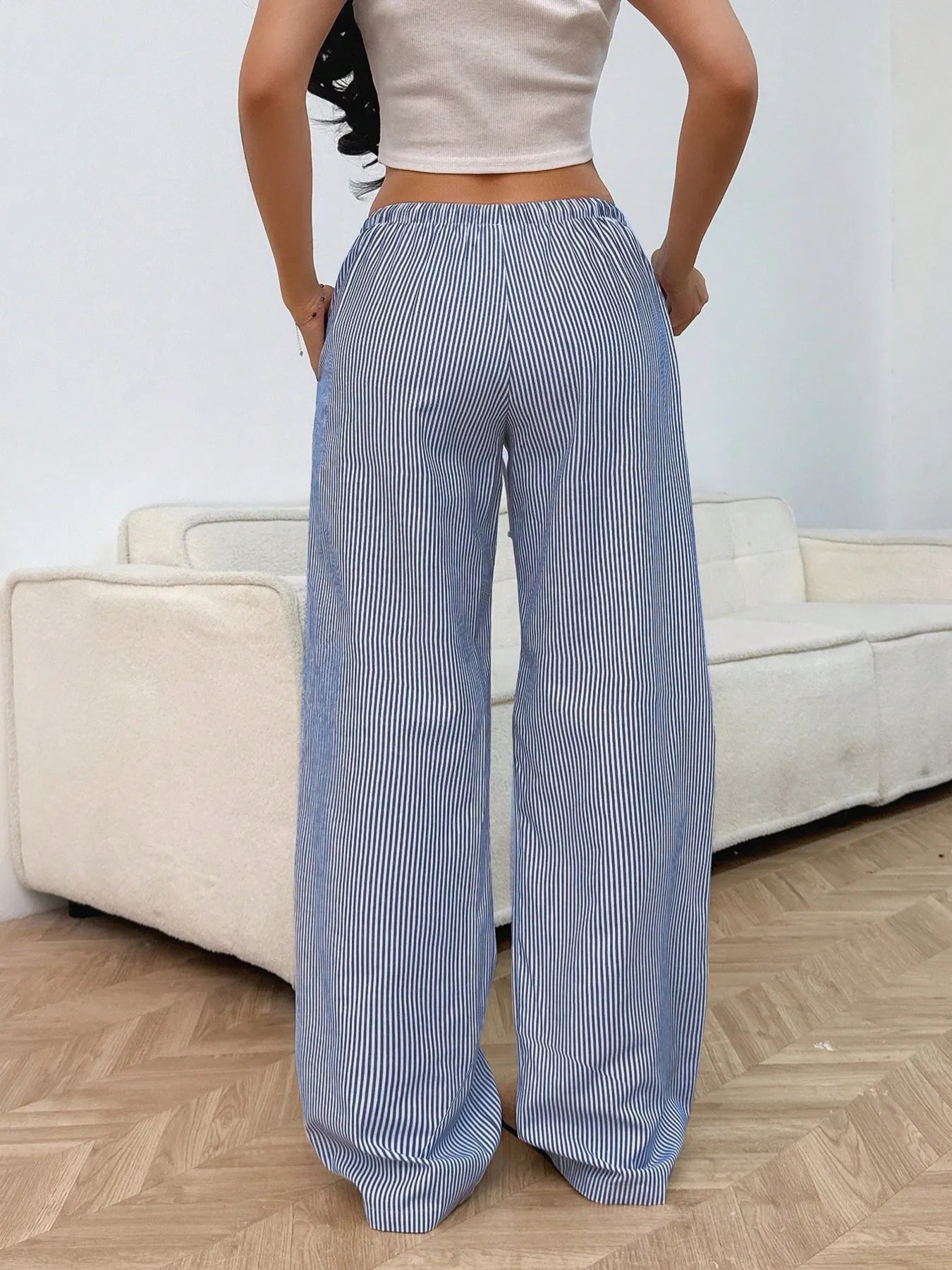Light blue striped wide-leg pants with elastic waist and drawstring tassels