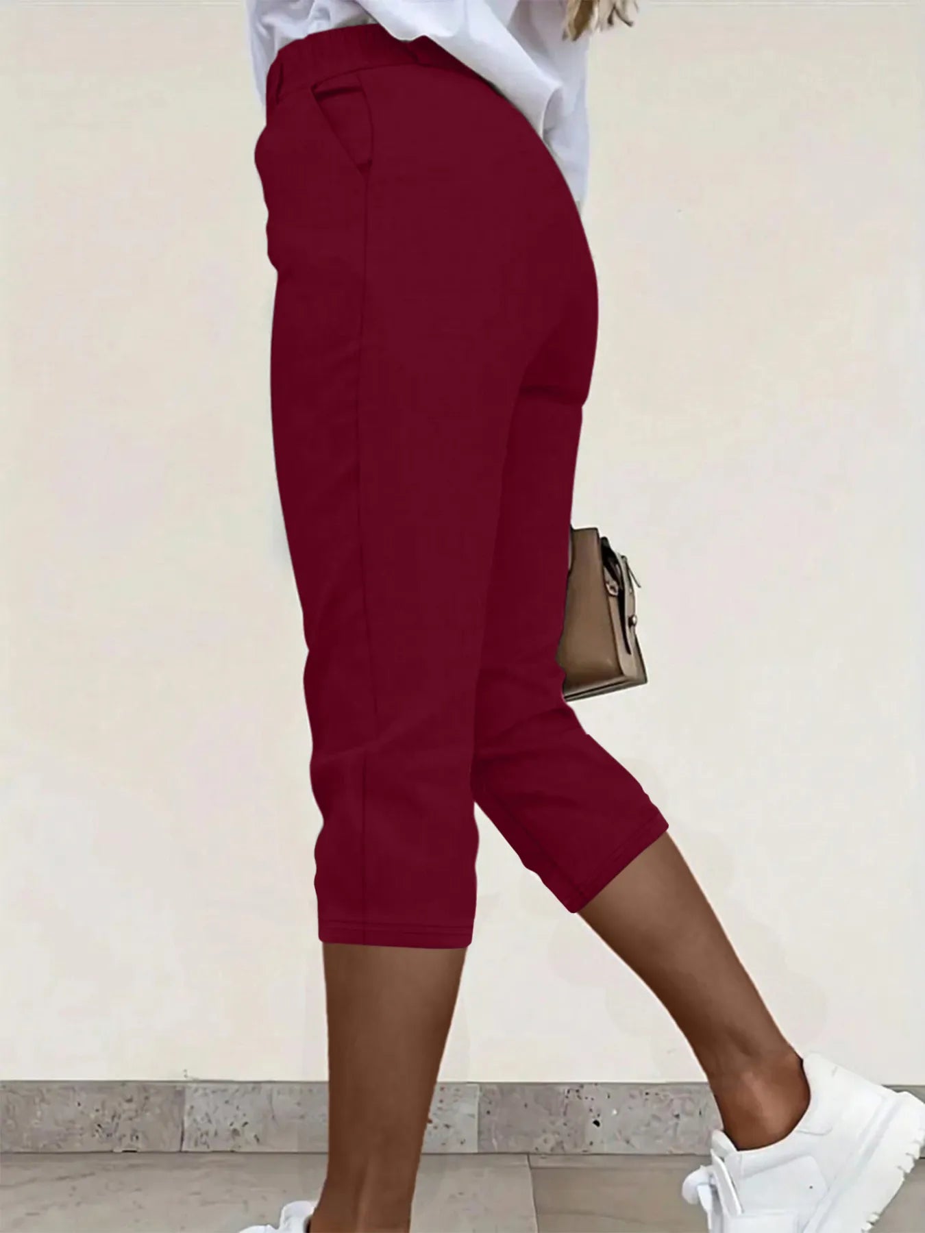 Burgundy pleated detail pants with pockets, cropped hem and cuffed ankle length