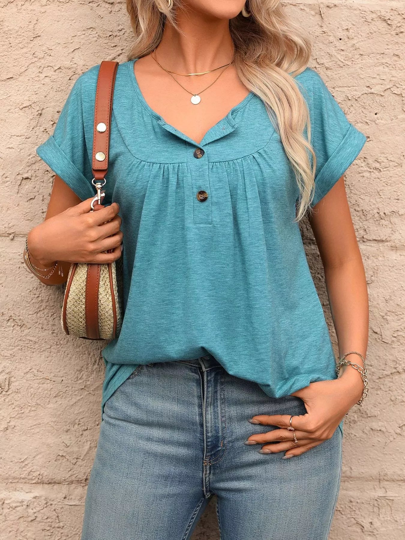 Teal henley-style T-shirt with short sleeves and button-front detail