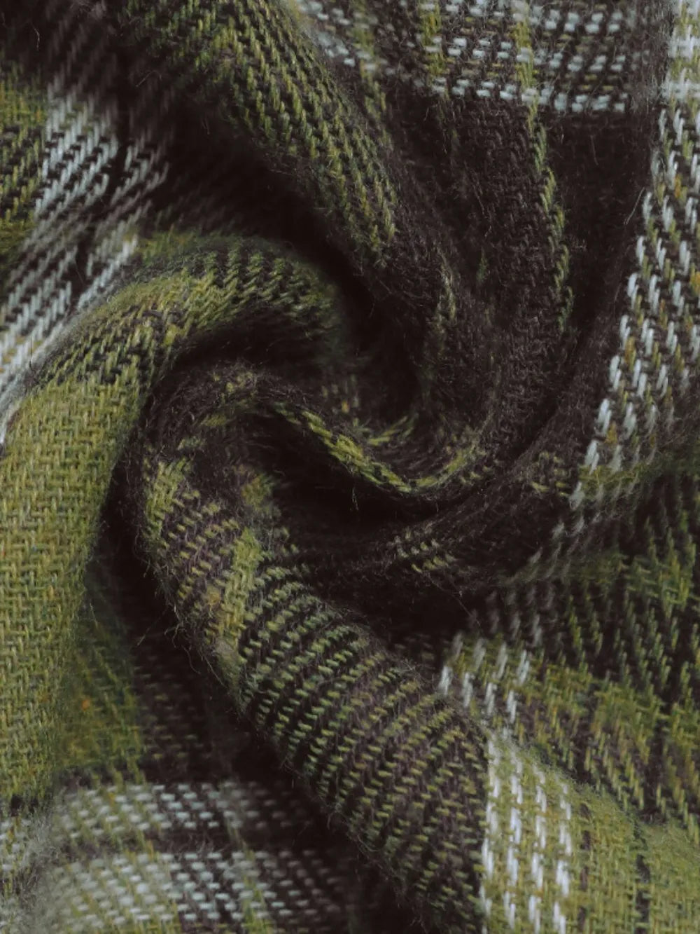 Close-up plaid fabric in olive green, tan, and dark brown woven texture