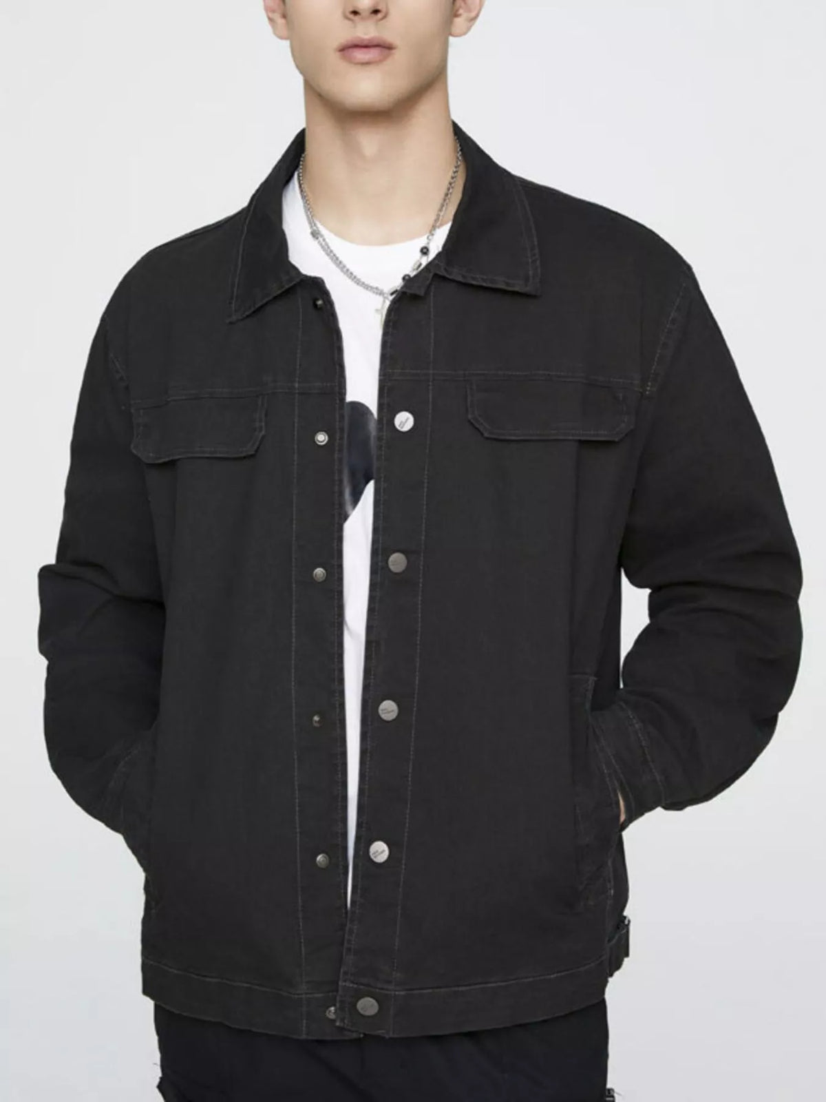 Men's black cotton button-up jacket with chest flap pockets and snap-front closure