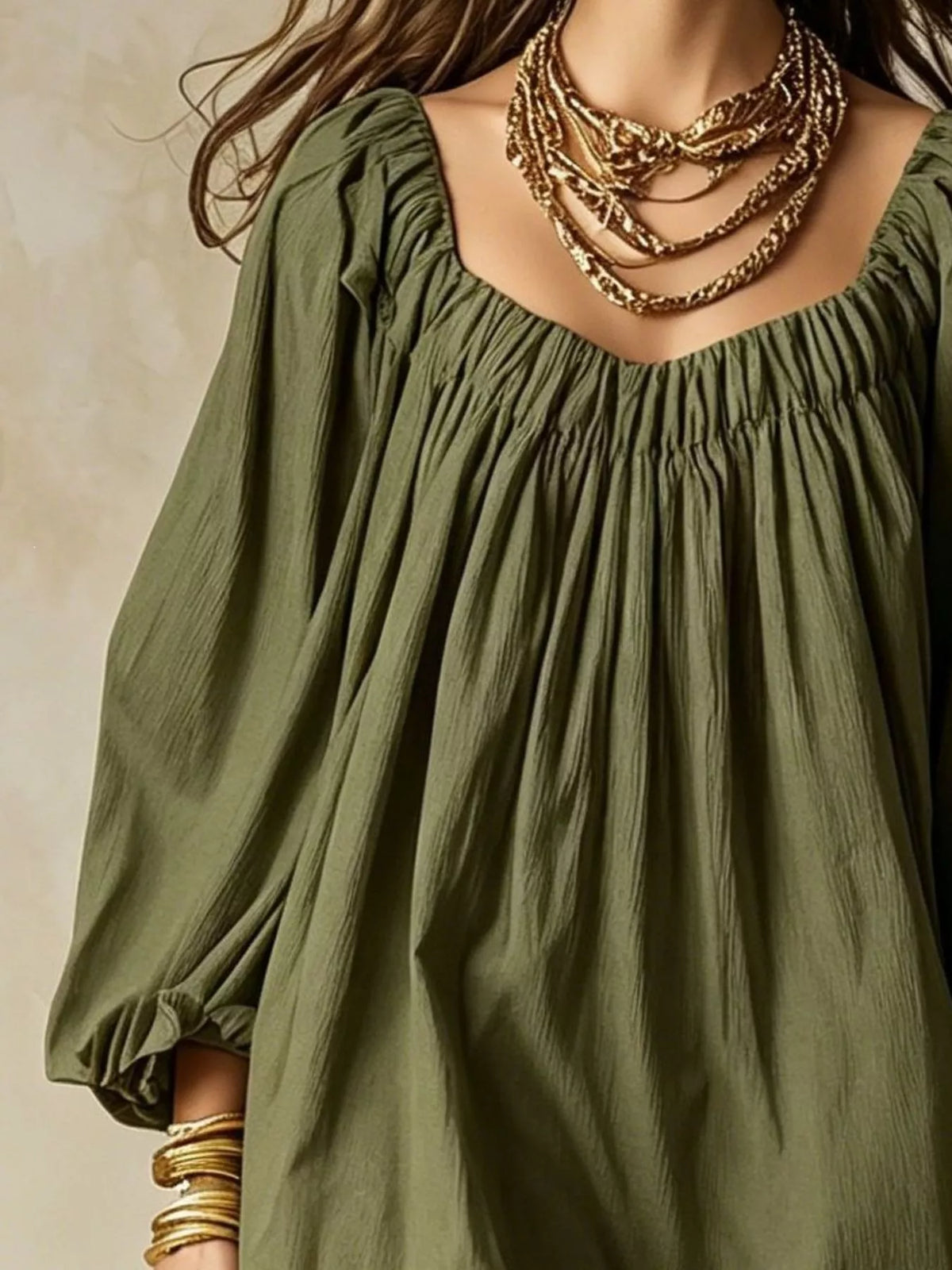 Army green mini dress with square neckline, pleated bodice, and balloon sleeves
