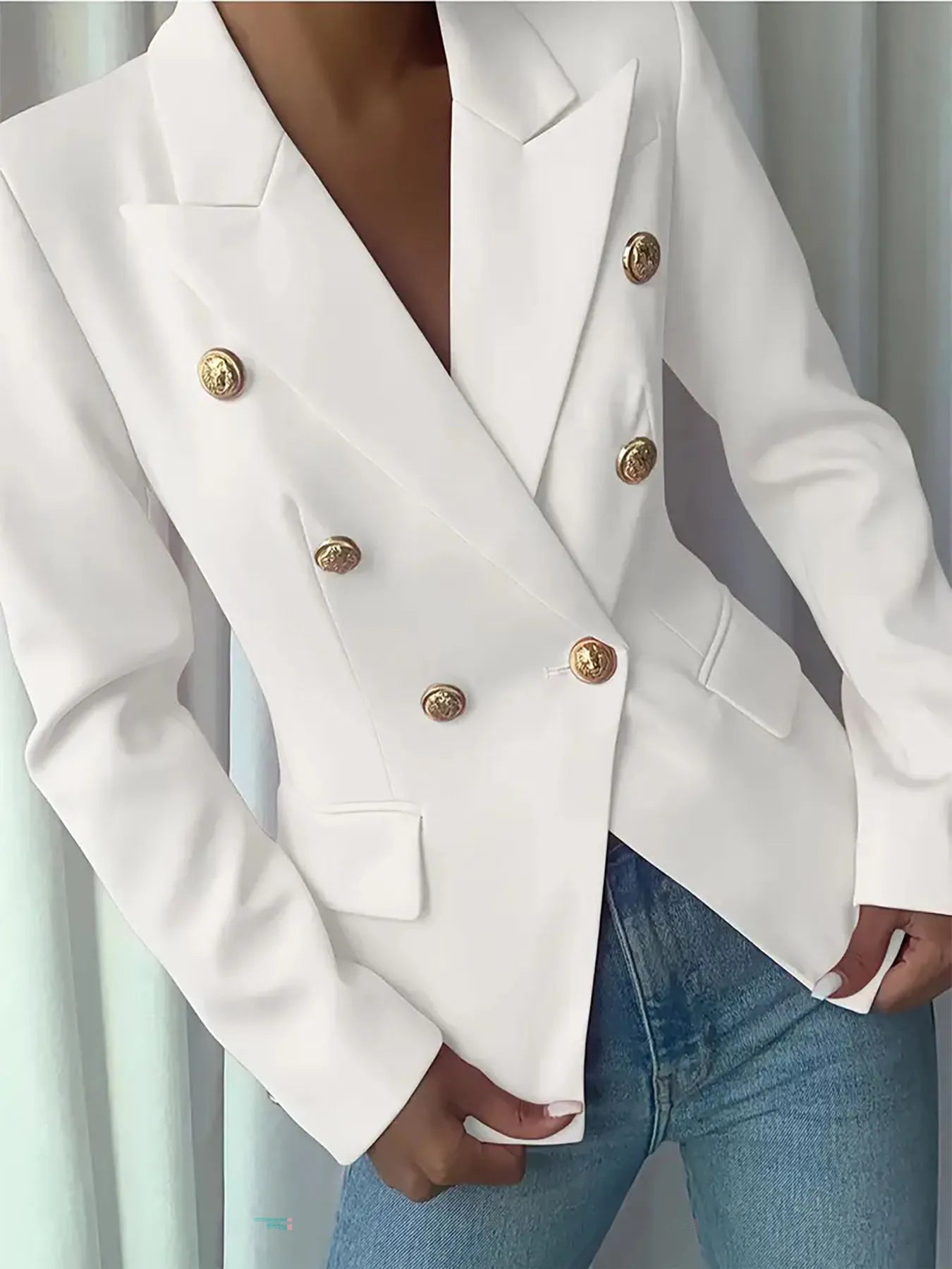 White lapel blazer with gold decorative buttons, structured shoulders, and front pockets