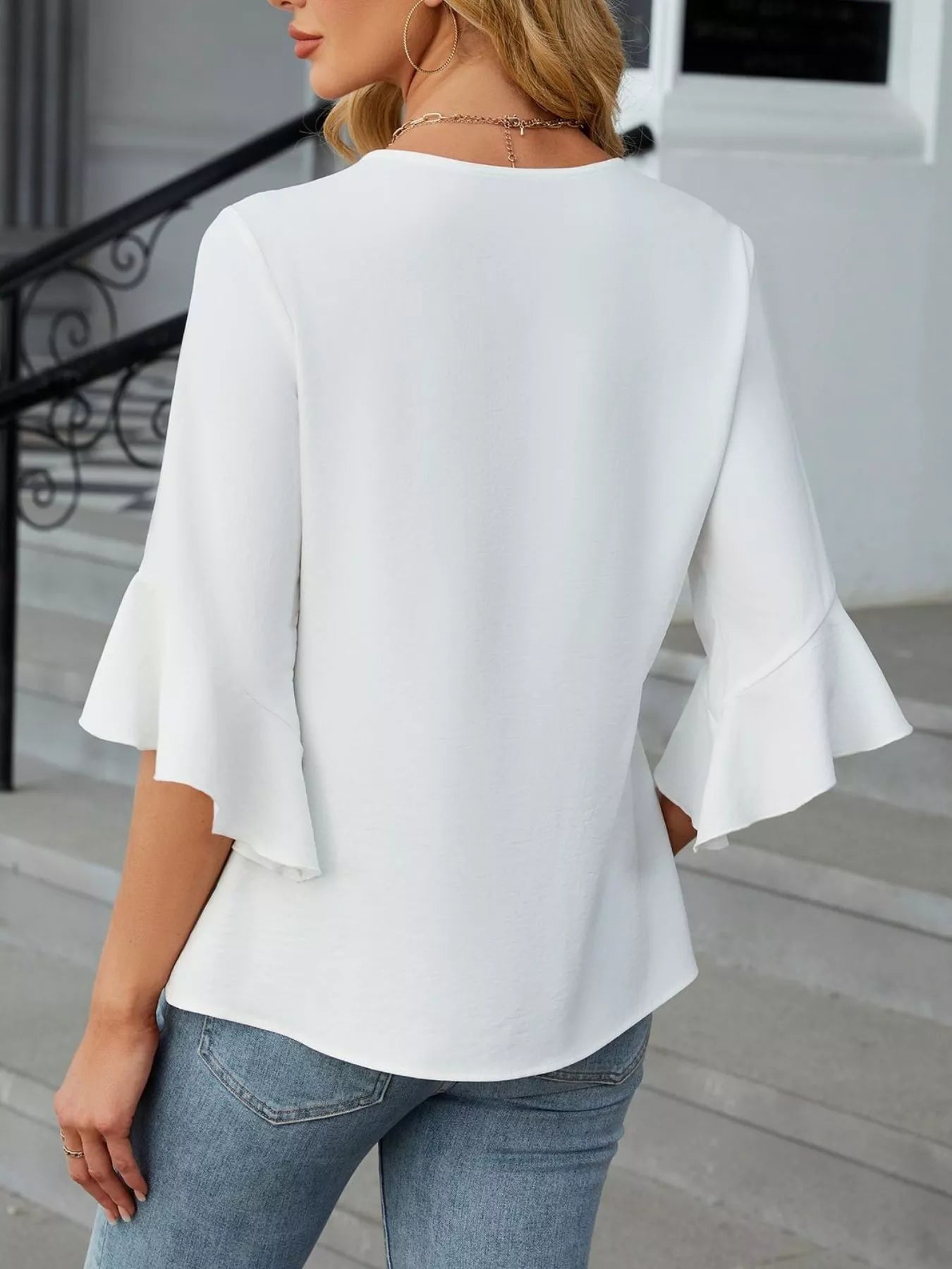 V-Neck Ruffle Sleeve Blouse in white by Trendsi, back view