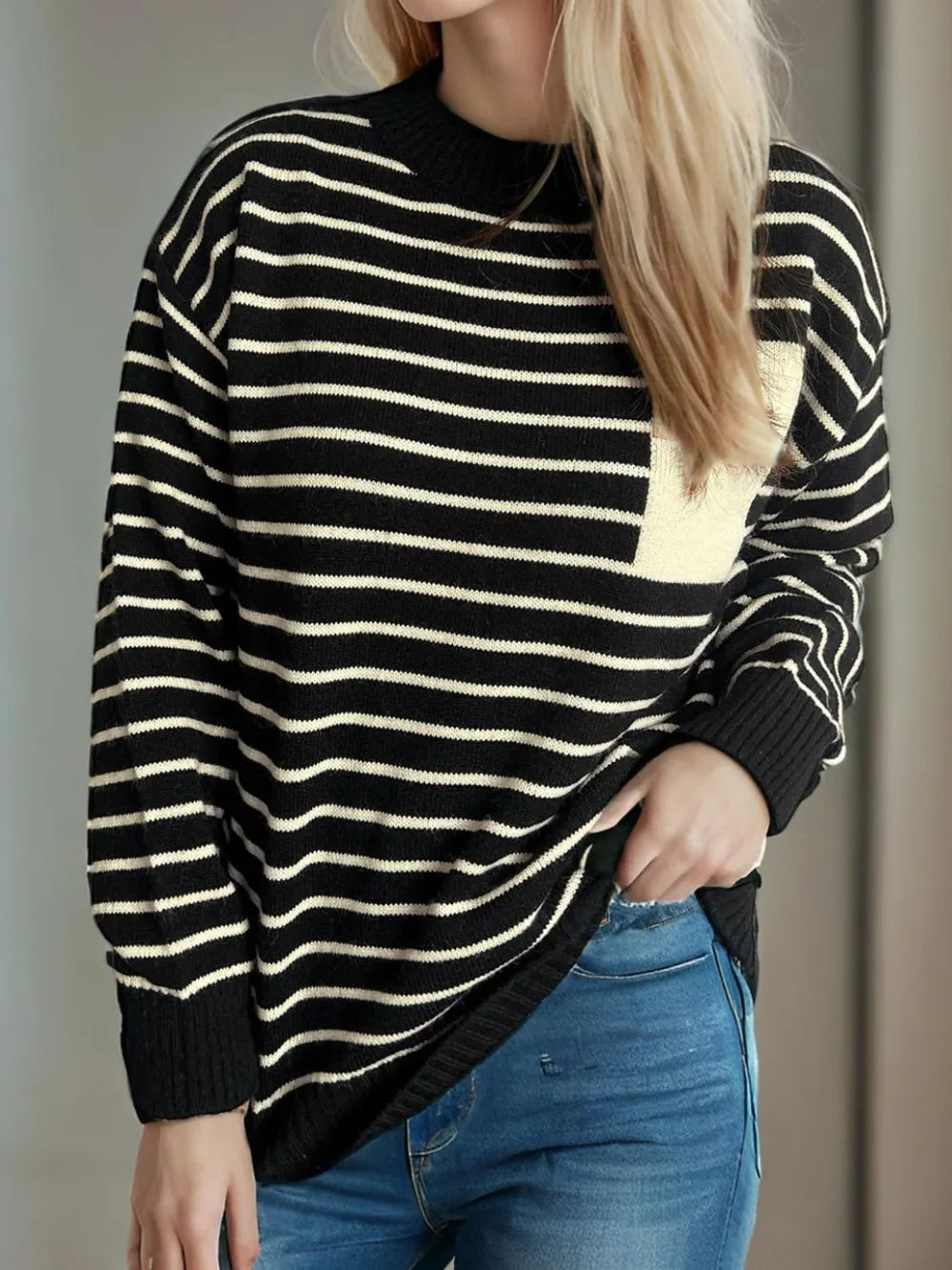 Striped mock neck long-sleeve sweater with black body and cream thin horizontal stripes