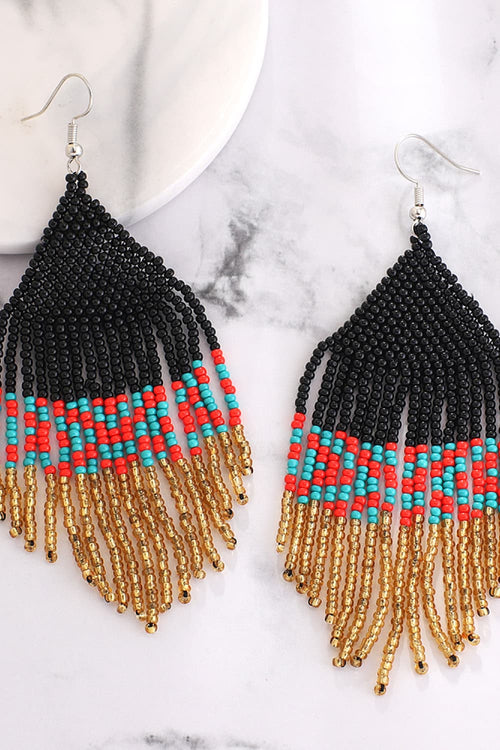 Beaded dangle earrings with black bead top, turquoise band, gold-tone fringe