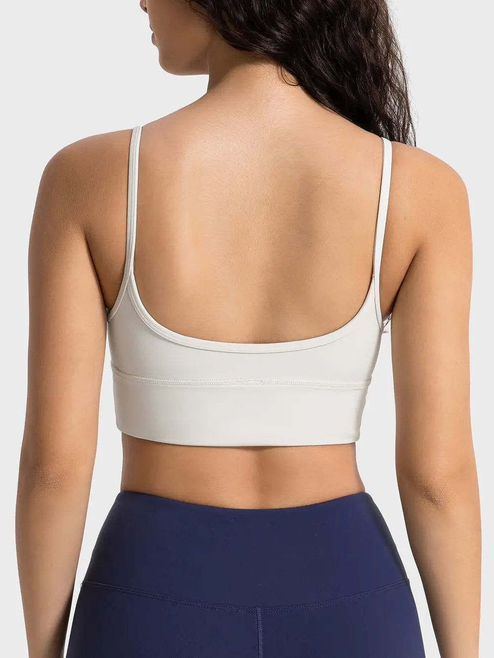 Ivory spaghetti strap sport bra with open scoop-back design