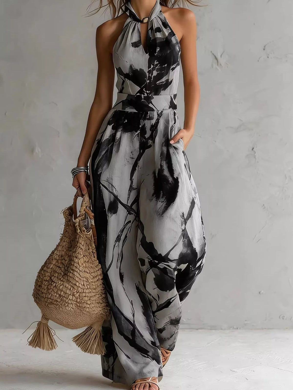 Dark gray ink-wash halter wide-leg jumpsuit with tie halter neck and wide legs