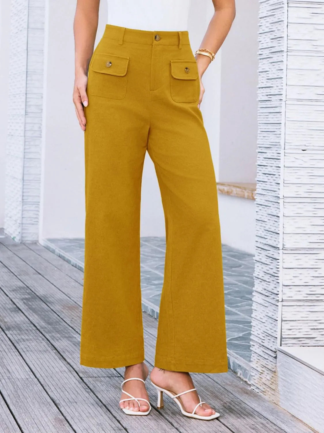 High waist wide leg pants in mustard yellow with front button and two flap pockets
