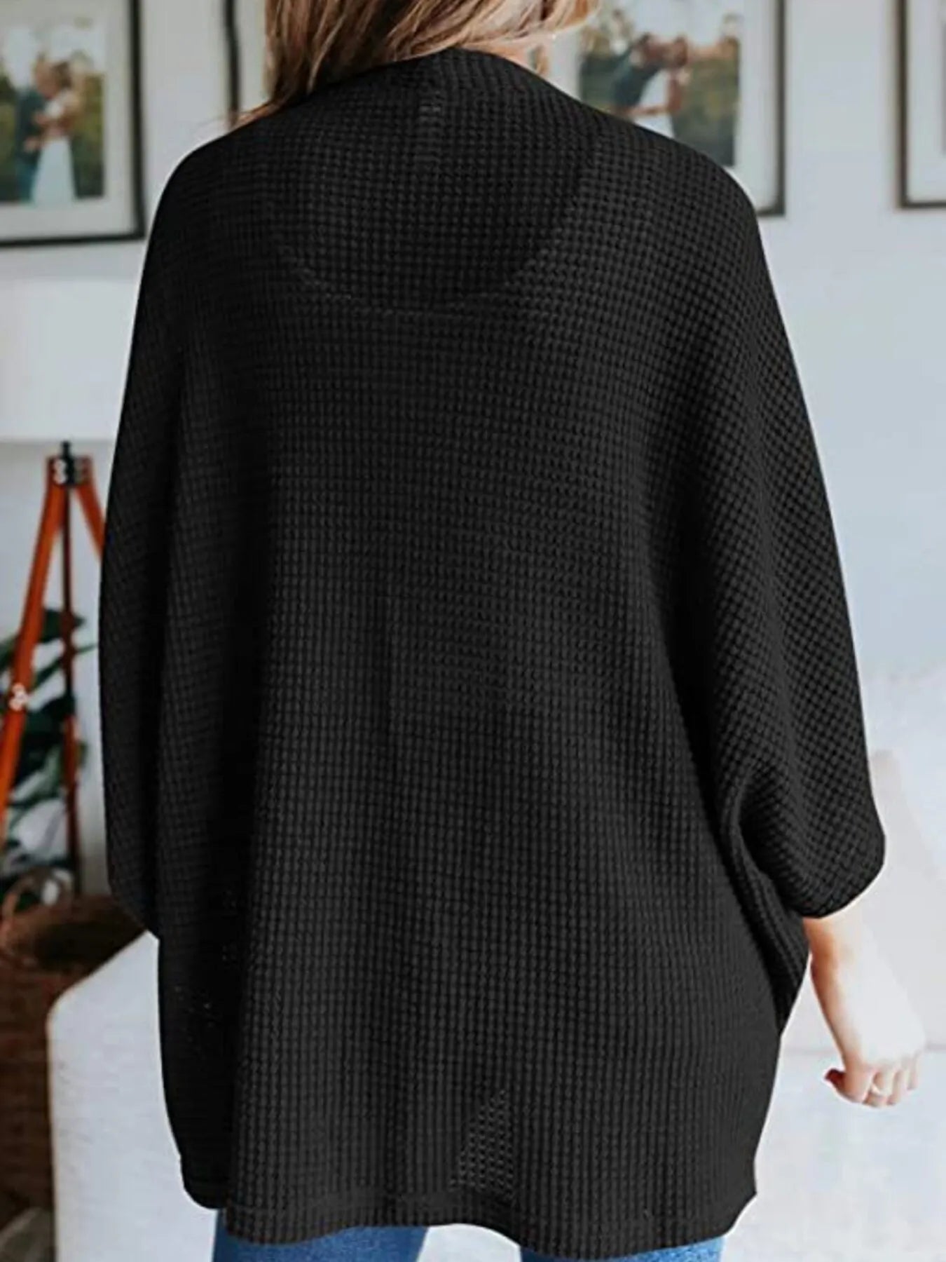 Black waffle knit open-front cardigan with relaxed plus-size fit and three-quarter sleeves